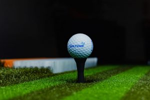 Golf simulator with auto ball return and tee